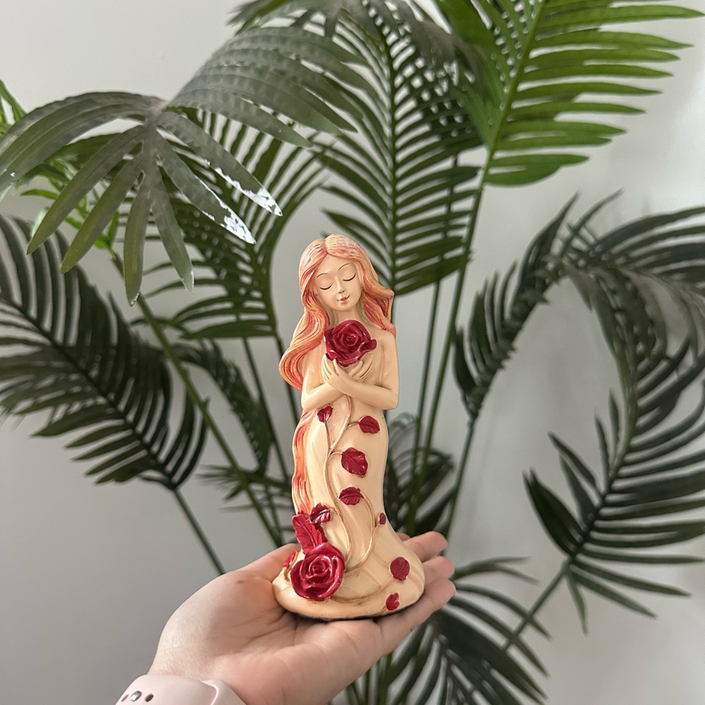 Elegant Figurine with Red Roses